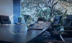 Portátil nunha mesa de reunións.